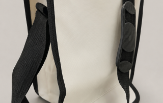 White six-bottle insulated bag with a black carrying strap